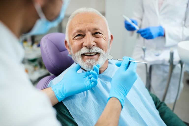 Happy,Mature,Man,During,Teeth,Check-up,At,A+ Family Dental Solutions